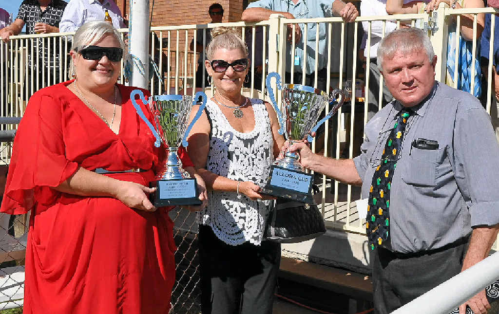 WINNER: Janelle Baker (middle) accepts the trophy from Robyn Miles (left) of the Railway Hotel Allora and Southern Downs councillor Glyn Rees (right) after Gaelstorm took out the Railway Hotel Allora Cup Benchmark 70 Handicap 1200m in January.